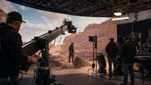 Modern Hollywood film crew using LED wall, camera crane, and lighting technology on set